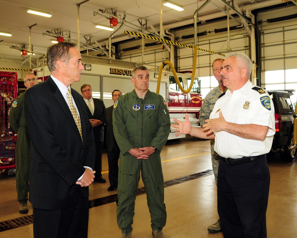 Congressman Chris Collins (NY-27) is being briefed by Ed MacDonald (far right), Fire Chief, Niagara Falls Air Reserve Station Fire Department while Col. John Higgins (center) Commander, 107th Airlift Wing and others look on here at the base on April 29, 2013. The Congressman was on hand for an official fact finding tour of the units and its facilities at the base. (U.S. Air Force Reserve photo by Peter Borys)