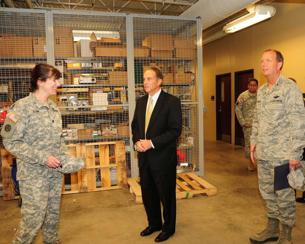 Congressman Chris Collins (NY-27) is being briefed by Army LtCol. Dawn Flynn (left), Assistant Chief Nurse, 865th Combat Support Hospital while Col. Allan Swartzmiller (right), Commander, 914th Airlift Wing looks on at the Niagara Falls Air Reserve Station on April 29, 2013. The Congressman was at the base for an official fact finding tour of the units and its facilities at the base. (U.S. Air Force Reserve photo by Peter Borys)