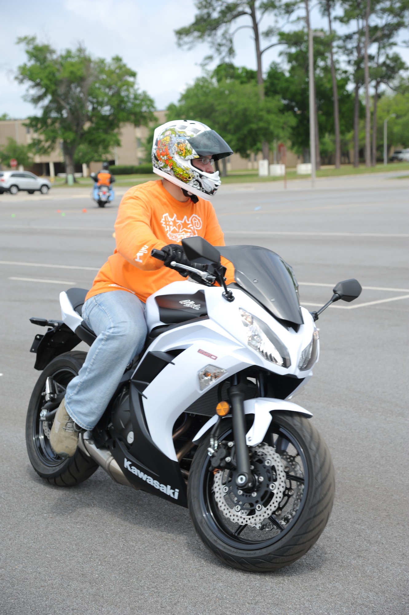 Senior Airman Josh Bruchwalski, 345th Airlift Squadron, drives around the motorcycle driving course during  motorcycle safety training April 18, 2013, at Keesler Air Force Base, Miss.  The course is offered two times a month and teaches students the basic operating skills and safety rules for riding a motorcycle on the road.  (U.S. Air Force photo by Kemberly Groue)