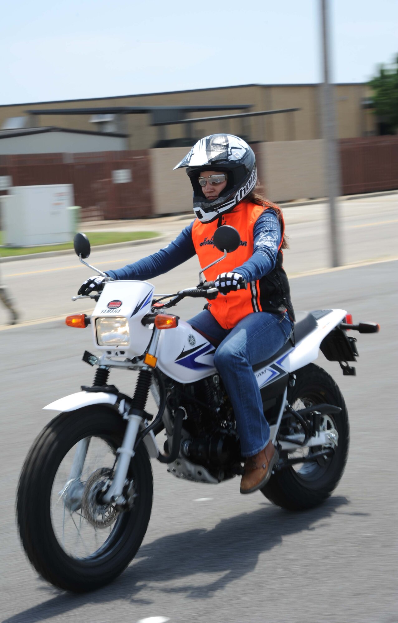 Tech. Sgt. Tiffany Taylor, 81st Inpatient Operation Squadron, drives around the motorcycle driving course during a motorcycle safety training April 18, 2013, at Keesler Air Force Base, Miss.  The course is offered two times a month and teaches students the basic operating skills and safety rules for riding a motorcycle on the road.  (U.S. Air Force photo by Kemberly Groue)