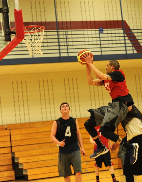 Senior Airman Rawlinson Santaella, 28th Maintenance Squadron crew chief, takes a shot inside the paint during the base 2013 Intramural Basketball League championship game in the Bellamy Fitness Center at Ellsworth Air Force Base, S.D., April 24, 2013. During the final game, the 28th Security Forces Squadron squared off against their rivals, the 28th Aircraft Maintenance Squadron, and took the win, 79-62. (U.S. Air Force photo by Airman 1st Class Hrair H. Palyan/Released) 