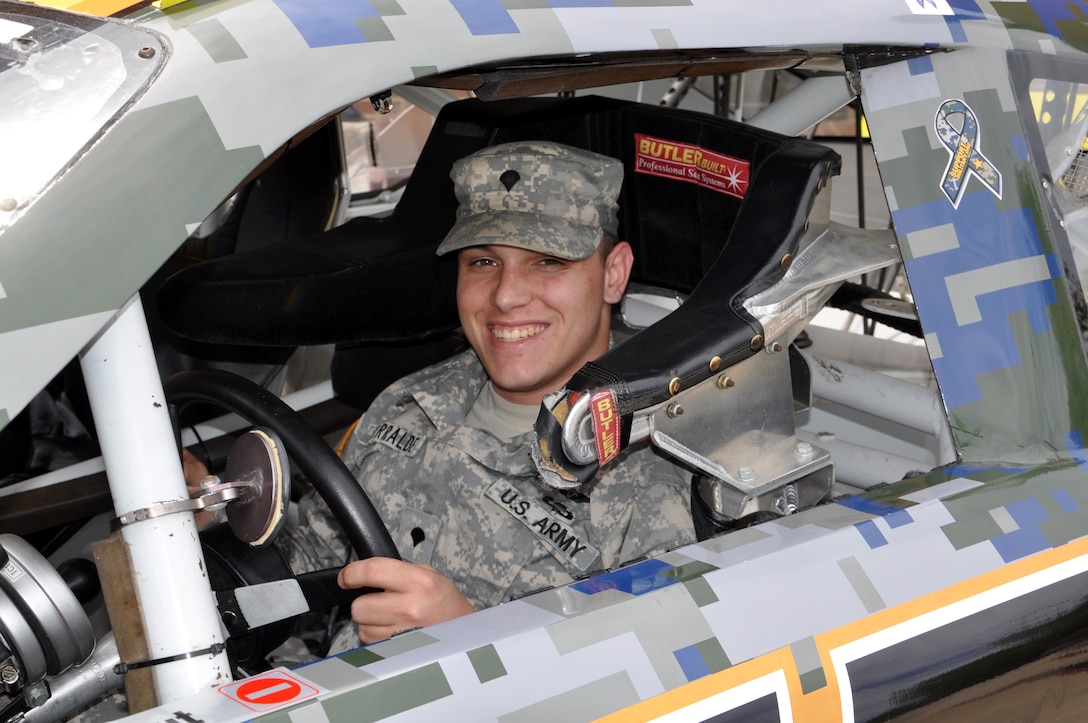 Spc. Matthew Yturralde, 128th Aviation Brigade UH-60 Black Hawk mechanic, experiences what it’s like to be inside of a NASCAR show car at Fort Eustis, Va., April 4, 2013. The display aimed to build Soldier morale and promote SupportMilitary.org. The Support Military mission is to link America to verified organizations that provide needed support to active duty, National Guard, reserve, veterans and their families. (U.S. Air Force photo by Tech. Sgt. April Wickes/Released)