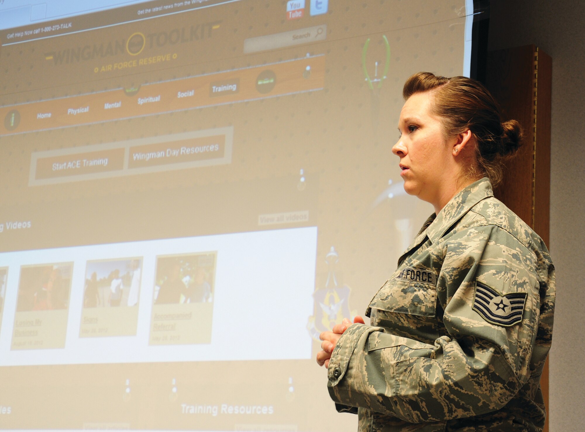 WRIGHT-PATTERSON AIR FORCE BASE, Ohio - Tech. Sgt. Ashley Dahl, 445th Maintenance Operations Squadron training technician, discusses activities planned for her unit’s Wingman Day during the April 7 unit training assembly. Wingman Day allows units to partake in activities meant to encourage camaraderie and improve resilience. (U.S. Air Force photo/Airman 1st Class Santana Austin)
