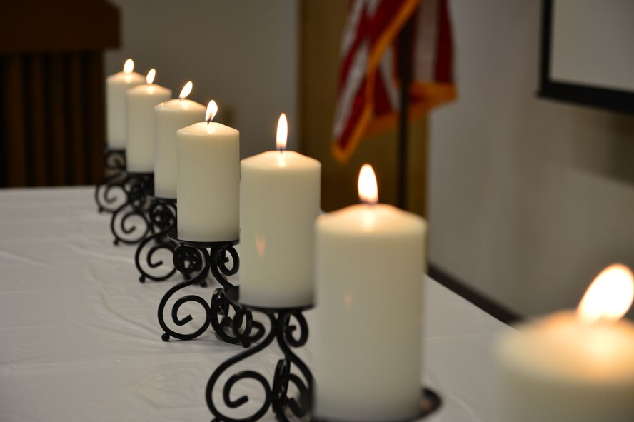 Each candle was lit at the front of the room by one of seven volunteers during a pledge to remember our lessons learning from the tragedy of the Holocaust and a call to take personal action against hatred and discrimination. Holocaust Remembrance Day is recognized all over the world in the month of April and was held at Cannon Air Force Base, N.M., April 13, 2013. (U.S. Air Force photo/2nd Lt. Angelica Powell). 