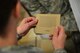 A U.S. Air Commando reads about the life of a survivor of the Holocaust. Holocaust Remembrance Day is recognized all over the world in the month of April and was held at Cannon Air Force Base, N.M., April 13, 2013. (U.S. Air Force photo/2nd Lt. Angelica Powell). 