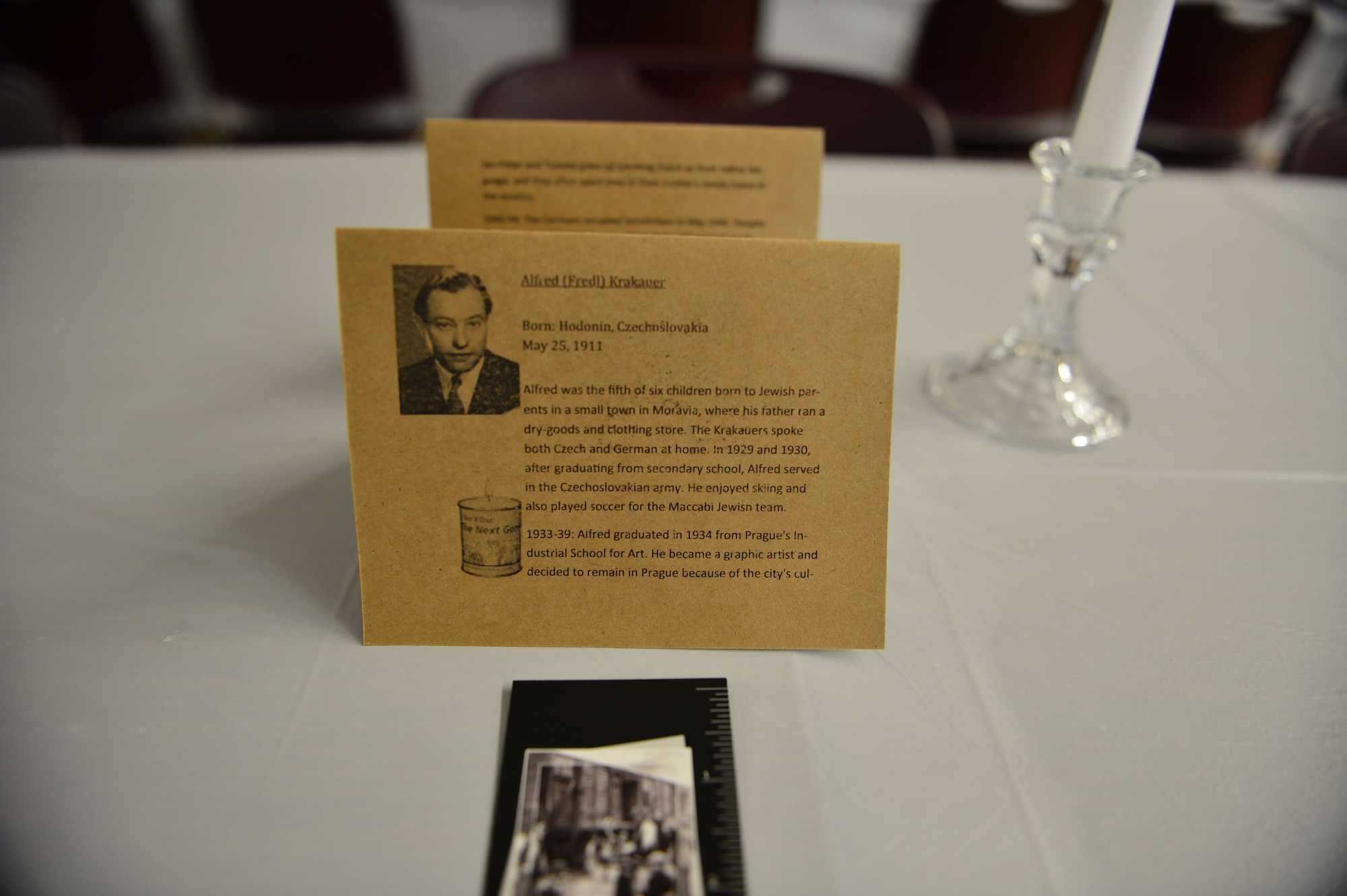 A biographical card was placed at every seat, each telling the story of one of the many men and women who perished or survived the Holocaust. Holocaust Remembrance Day is recognized all over the world in the month of April and was held at Cannon Air Force Base, N.M., April 13, 2013. (U.S. Air Force photo/2nd Lt. Angelica Powell). 