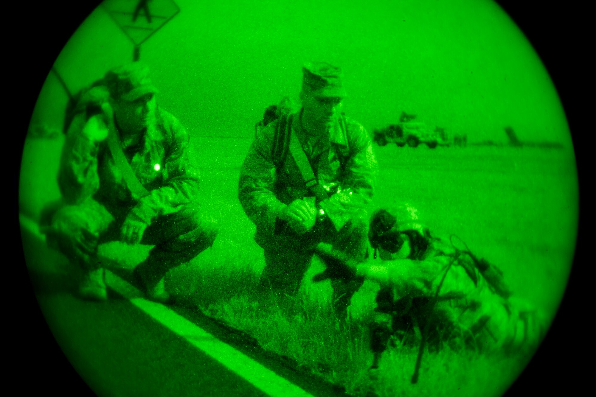 U.S. Air Force Senior Airman Brandon Hood (right), 824th Base Defense Squadron fireteam leader, speaks with Master Sgts. Tracy Booth (center), Air Combat Command inspector general, and Jason Brown, 820th Combat Operations Squadron standards and evaluations superintendent, during a training exercise April 24, 2013, at Moody Air Force Base, Ga. For the first time ever, an ACC inspector general team visited Moody to evaluate the 820th Base Defense Group’s capabilities and witness what they bring to the fight downrange. (U.S. Air Force photo by Staff Sgt. Jamal D. Sutter/Released) 