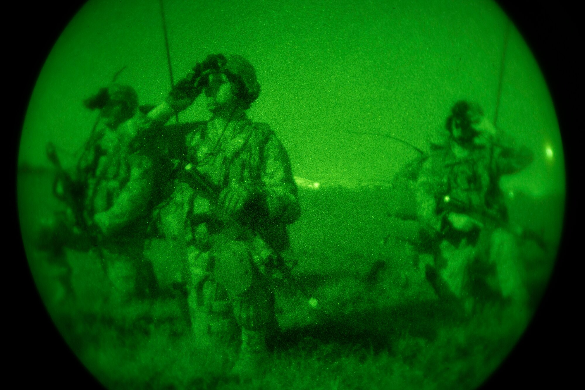 Airmen from the 820th Combat Operations Squadron assess the scene during a training exercise on the flightline April 24, 2013, at Moody Air Force Base, Ga. During the exercise, the 820th COS and 824th Base Defense Squadron helped seize the airfield and set up 360-degree parameter security around the flightline. (U.S. Air Force photo by Staff Sgt. Jamal D. Sutter/Released)  