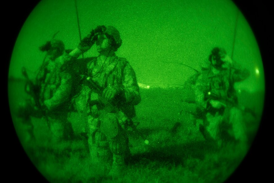 Airmen from the 820th Combat Operations Squadron assess the scene during a training exercise on the flightline April 24, 2013, at Moody Air Force Base, Ga. During the exercise, the 820th COS and 824th Base Defense Squadron helped seize the airfield and set up 360-degree parameter security around the flightline. (U.S. Air Force photo by Staff Sgt. Jamal D. Sutter/Released)  