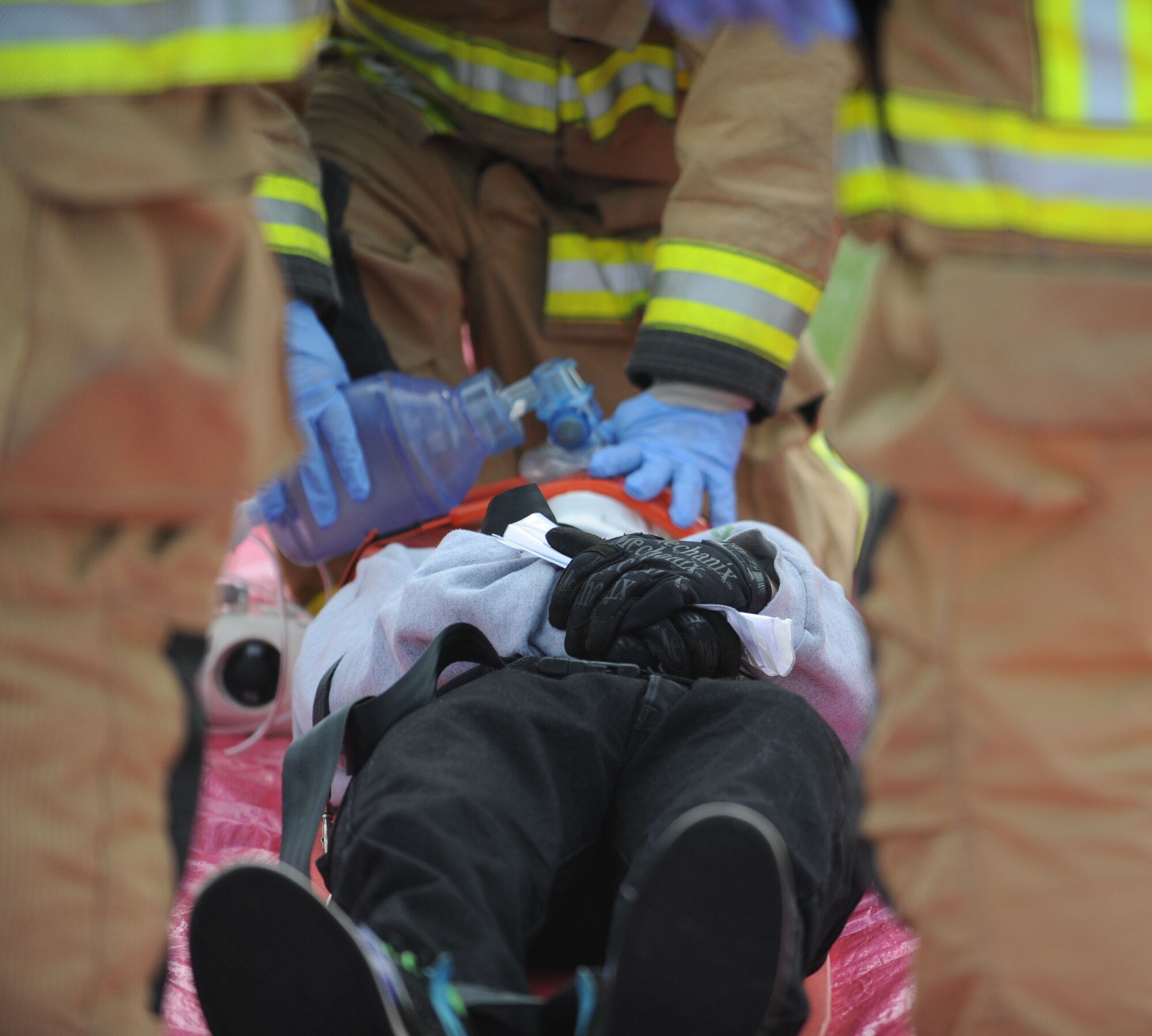 A firefighter with the 100th Civil Engineer Squadron ventilates a simulated casualty during an exercise April 29, 2013, on RAF Mildenhall, England. The “casualty” was unresponsive when found by firefighters after a “landing gear failure” of a KC-135 Stratotanker. [(Editor’s note: This image is from an exercise and does not depict any real world event.)(U.S. Air Force photo by Airman 1st Class Preston Webb/Released)] 