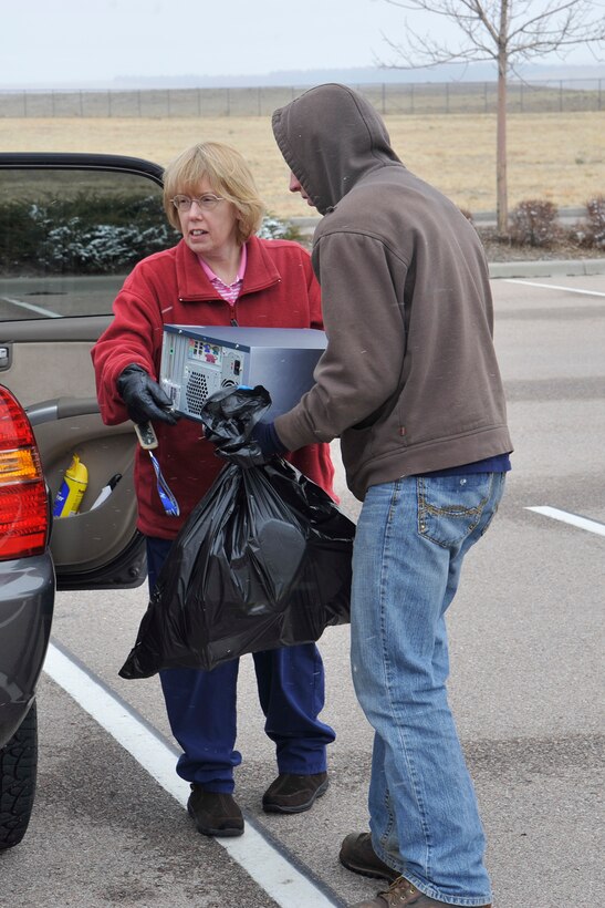 PETERSON AIR FORCE BASE, Colo. – An employee from Blue Star Recyclers helps an environmentally-conscious Team Pete member unload electronics for recycling April 23 at The Exchange. Base users were encouraged to drop off old electronics and appliances for recycling as part of the 21st Civil Engineer Squadron’s Earth Day activities. Blue Star Recyclers is a non-profit organization that has been providing support to Peterson since 2011. (U.S. Air Force photo/Rob Lingley)