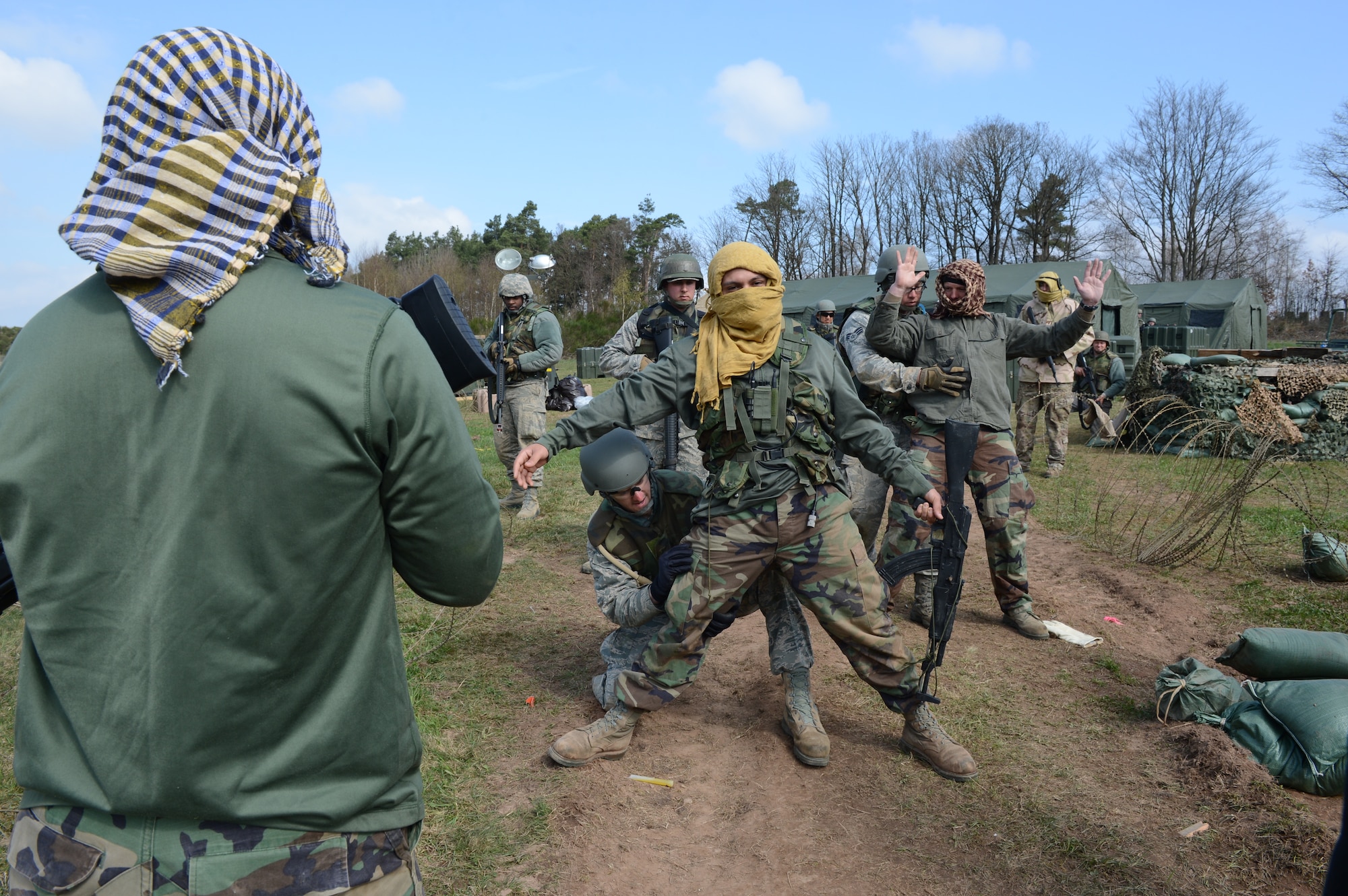 SPANGDAHLEM AIR BASE, Germany – Airmen from the 606th Air Control Squadron search opposing forces (OPFOR) during a combat readiness training course April 20, 2013. The searches are invasive in nature to all a thorough search of a detainee for any weapons or explosives. (U.S. Air Force photo by Airman 1st Class Kyle Gese/Released)