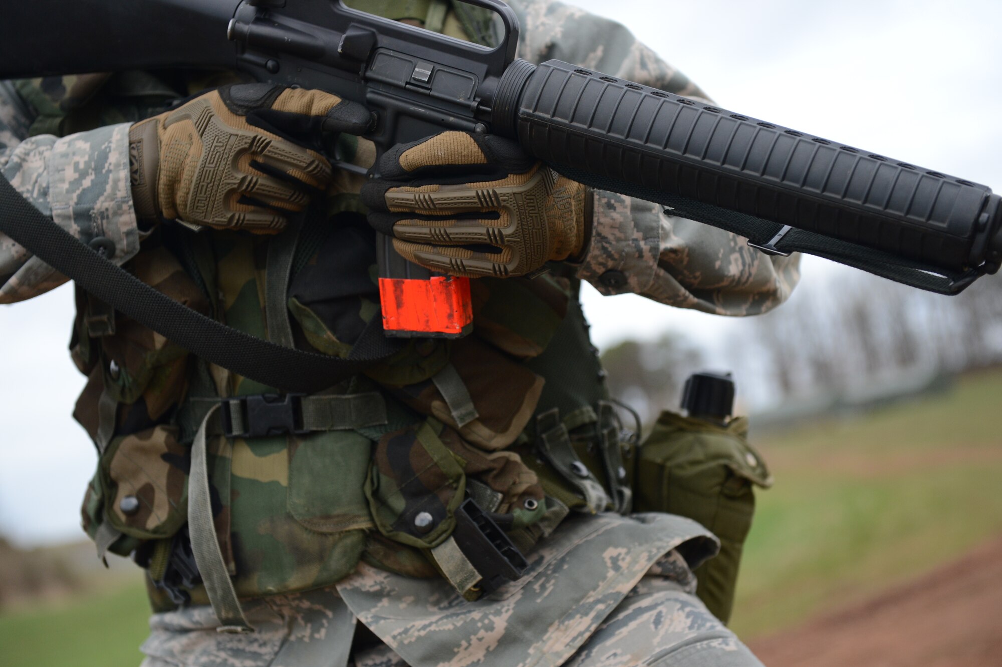 SPANGDAHLEM AIR BASE, Germany – U.S. Air Force Airman 1st Class Steven Silvis, 606th Air Control Squadron electrical power production journeyman from Aberdeen, Wash., holds his weapon at low ready during a combat readiness training course April 17, 2013. Scenarios were tailored to help Airmen learn how to react appropriately when faced with real-world problems. Scenarios included anything from talking to friendly locals to hostile mortar attacks. (U.S. Air Force photo by Airman 1st Class Kyle Gese/Released)