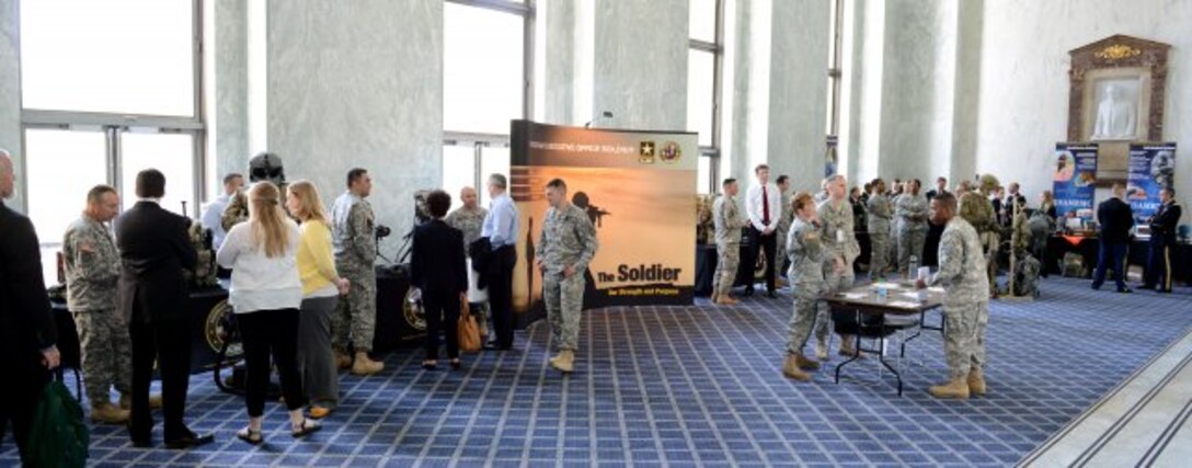 Members of Congress and staffers talk with Soldiers on the latest technologies and developments in military research and development and the importance of congressional funding during Army Day on Capitol Hill, April 25, 2013. (U.S. Army photo by Lisa Ferdinando/Released)