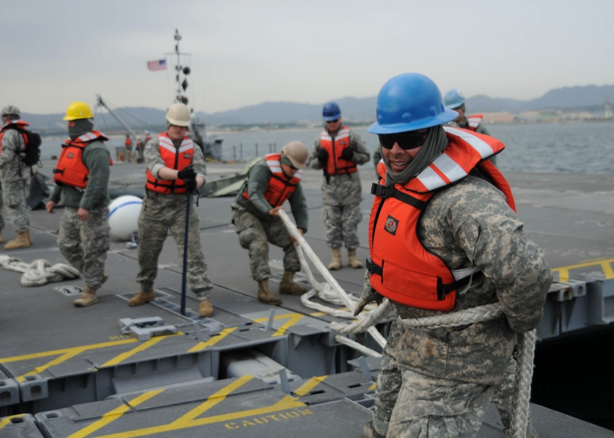 U.S. Army Soldiers assigned to the 331st Transportation Company, 7th Sustainment Brigade from Fort Eustis, Va., set up a modular causeway system on Dogu Beach near Pohang, South Korea, April 14, 2013. For many of the 331st Trans. Co. Soldiers, this is their first experience with such large pallets on the water, making safety a top priority. (U.S. Army photo by Sgt. Candace Le/Released)

