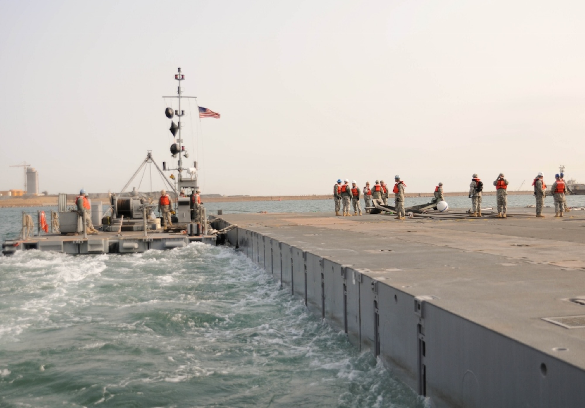 U.S. Army Soldiers assigned to the 331st Transportation Company, 7th Sustainment Brigade from Fort Eustis, Va., set up a modular causeway system on Dogu Beach near Pohang, South Korea, April 14, 2013. The MCS is a mobile port designed to load and unload equipment or personnel onto otherwise inaccessible land for either combat missions or humanitarian aid. (U.S. Army photo by Sgt. Candace Le/Released)

