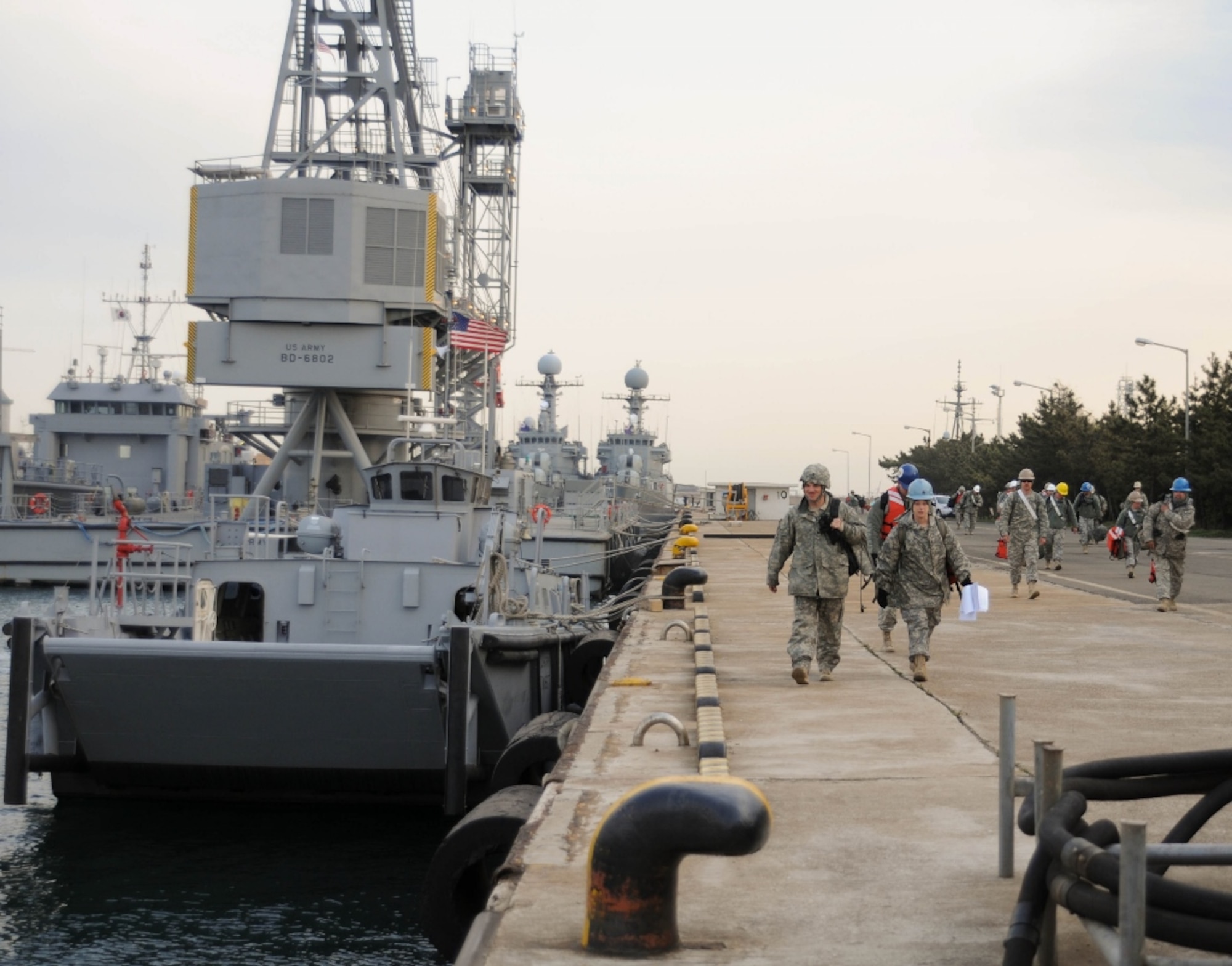 U.S. Army Soldiers assigned to the 331st Transportation Company, 7th Sustainment Brigade from Fort Eustis, Va., report to Pier 9 in Pohang, South Korea, April 14, 2013. The 331st Trans. Co. is working in support of the Combined Joint Logistics Over-the-Shore Exercise near Pohang. (U.S. Army photo by Sgt. Candace Le/Released)