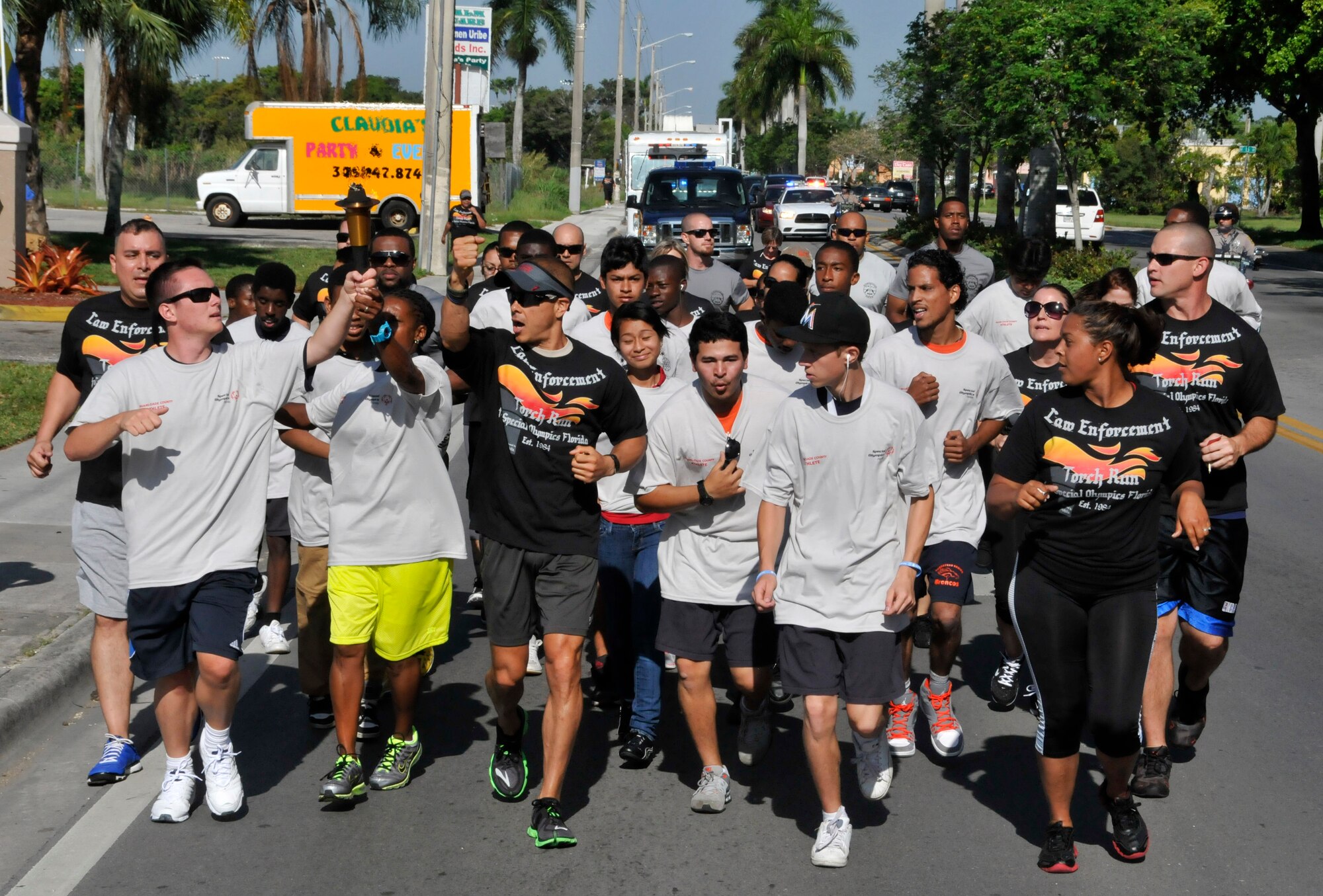 Airmen with the 482nd Security Forces Squadron from Homestead Air Reserve Base, Fla., participated in the Special Olympics Law Enforcement Torch Run, April 26, in Homestead, Fla., leading up to 2013’s Special Olympics Florida – Miami Dade County. The security forces Airmen, along with members of the law enforcement community from the city of Homestead, teamed up with Special Olympics athletes as they gear up for this year’s Olympics with Opening Ceremonies kicking off May 17. Law enforcement officers from more than 300 Florida agencies participate in the state-wide torch run to benefit the athletes of Special Olympics Florida. Each year, more than 5,000 officers carry the torch on a 1,500 mile relay through 66 counties in Florida. This event is held each year prior to Special Olympics Florida State Summer Games. (U.S. Air Force photos/Senior Airman Nicholas Caceres)