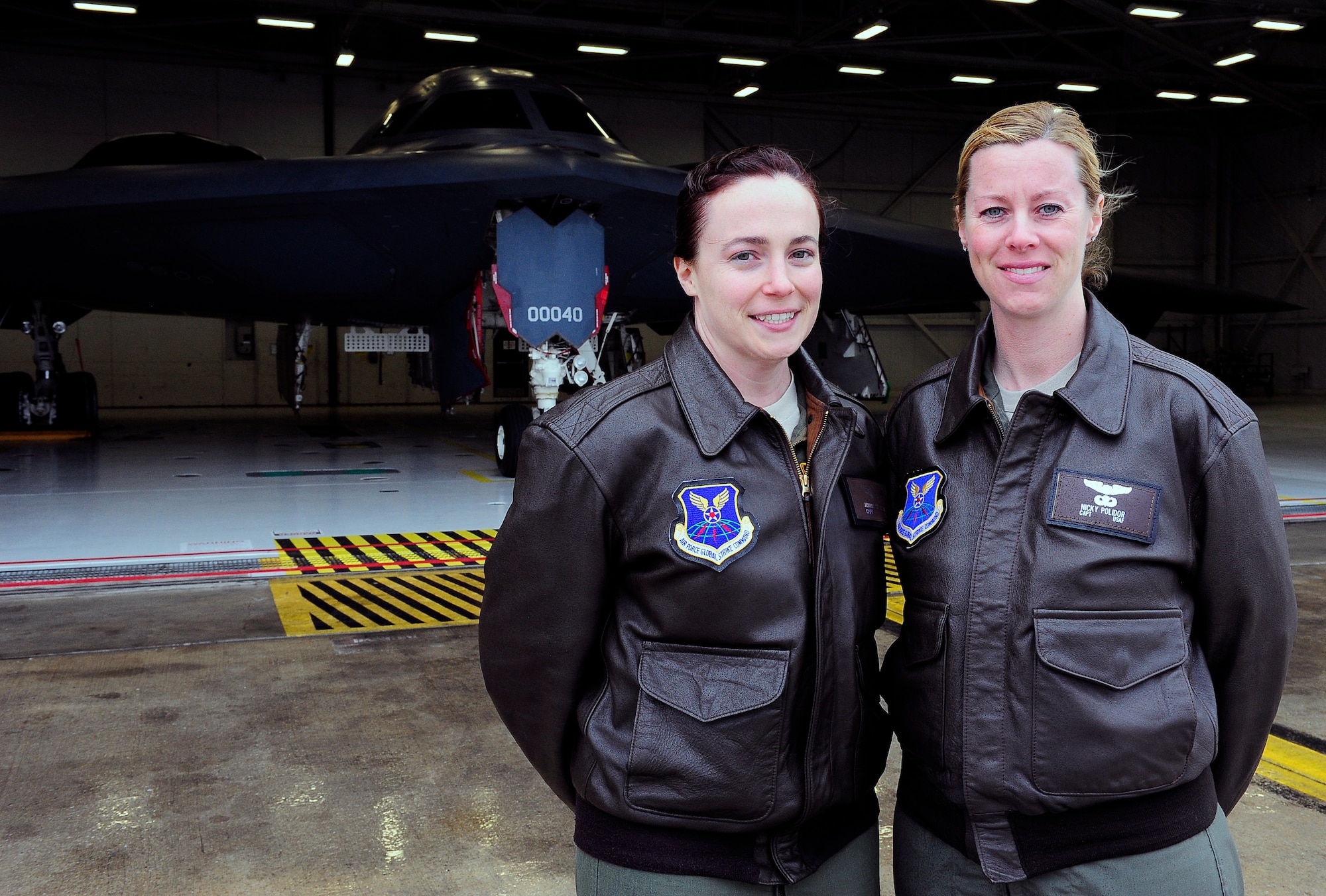 Captains Jennie Swiechowicz and Nicola Polidor, both 393rd Bomb Squadron B-2 Spirit pilots, are part of an elite group at Whiteman Air Force Base, Mo., April 23, 2013. Sweichowicz and Polidor both dreamed of flying while growing up. (U.S, Air Force photo by Airman 1st Class Shelby R. Orozco/Released)