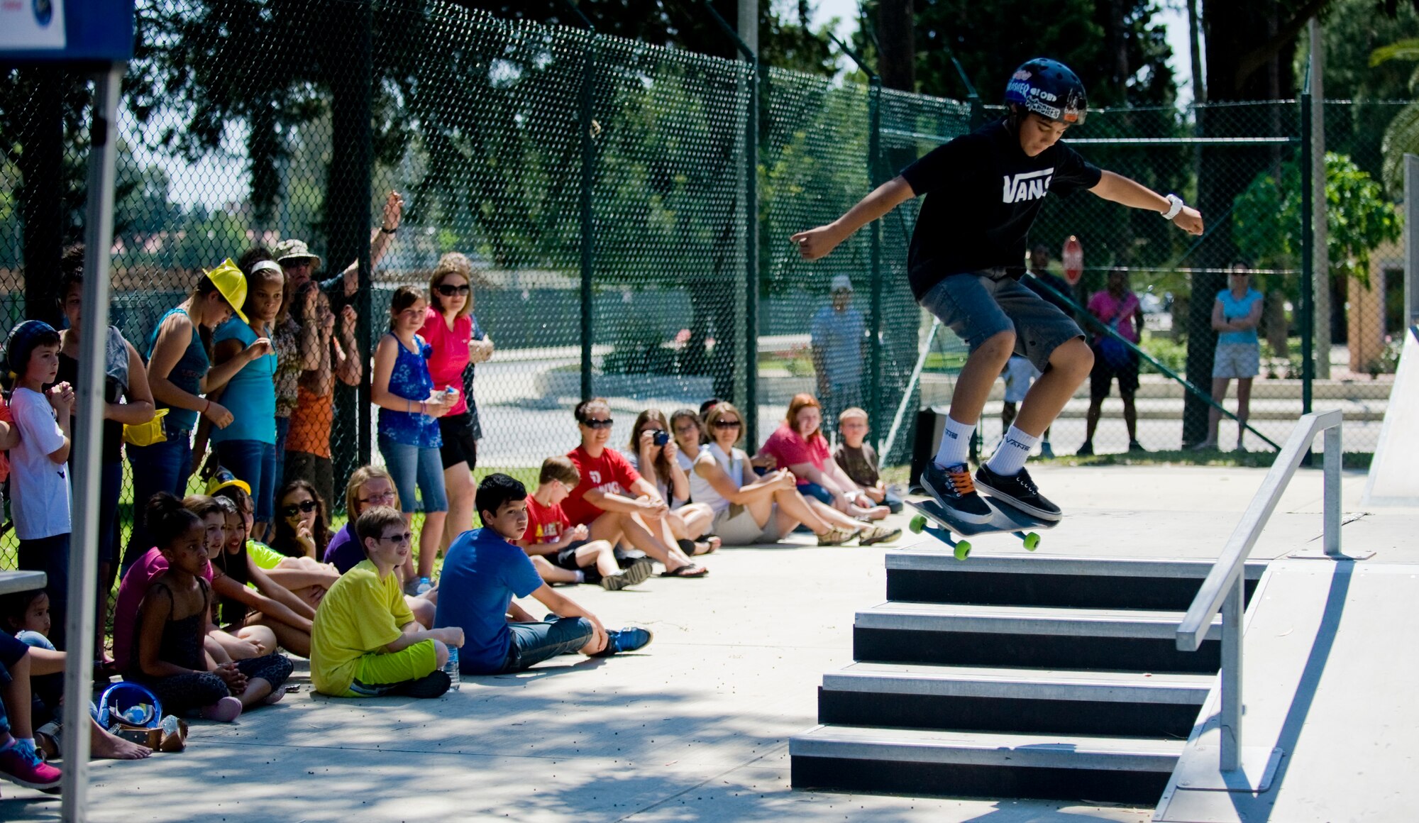 A contestant in the skate board competition jumps down the stairs during Spring-A-Palooza April 27, 2013, at Incirlik Air Base, Turkey. The grand finale event to celebrate the Month of the Military Child at Incirlik was Spring-A-Palooza. (U.S. Air Force photo by Staff Sgt. Veuril McDavid/Released)