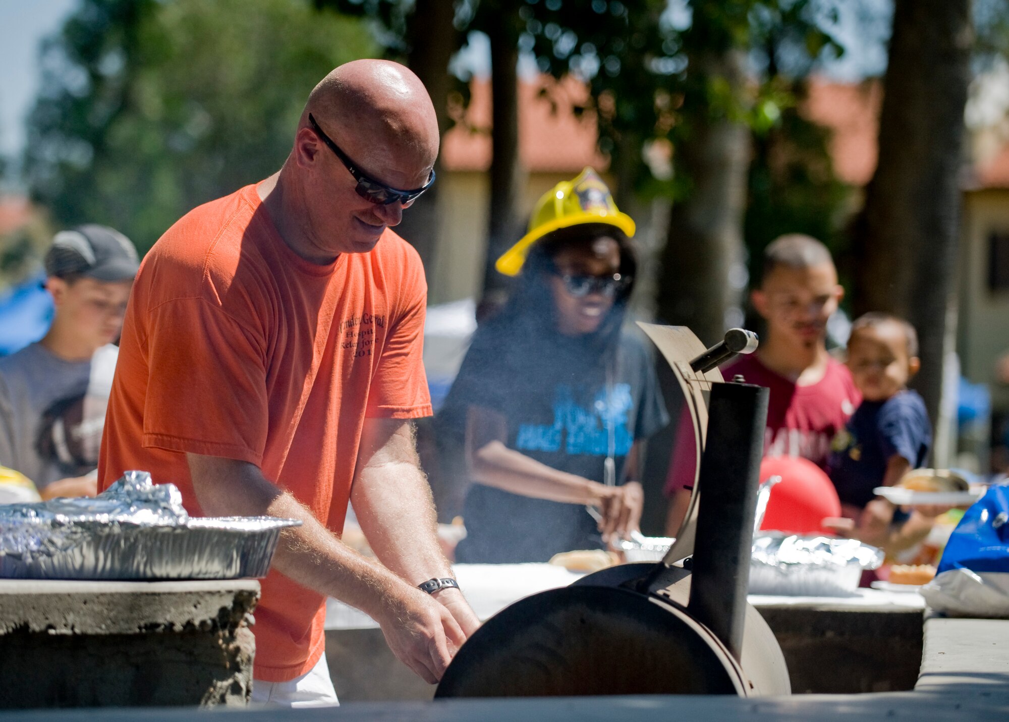 Master Sgt. Heath Benton grills hotdogs during the Spring-A-Palooza event April 27, 2013, at Incirlik Air Base, Turkey. Spring-A-Palooza was held to celebrate the Month of the Military Child. (U.S. Air Force photo by Staff Sgt. Veuril McDavid/Released)
