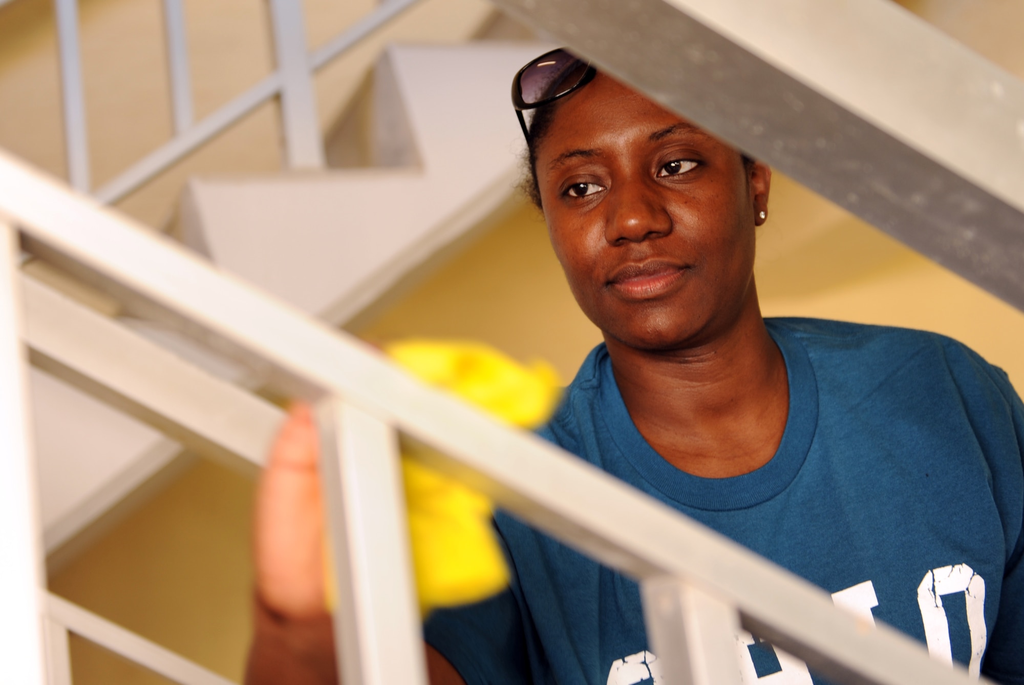Tech. Sgt. Jameliah Brooks, 39th Maintenance Squadron administrator, cleans the rails of a stairway in the dorms as part of the second annual Dorm Spring Cleaning April 26, 2013, at Incirlik Air Base, Turkey. The cleaning was held as way to for Airmen to take care of the dorms as a team. (U.S. Air Force photo be Senior Airman Daniel Phelps/Released)