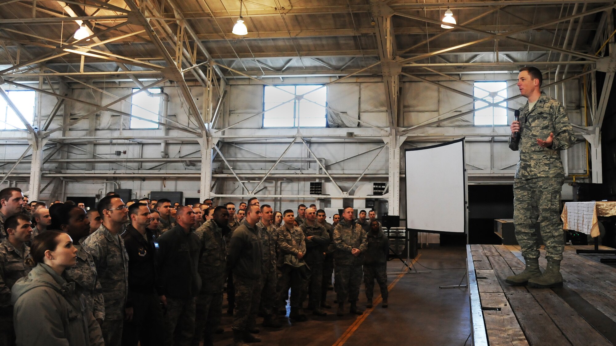MINOT AIR FORCE BASE, N.D. – Col. Alexis Mezynski, 5th Bomb Wing Commander, addresses the wing during an all call on wingman day here April 19. Col. Mezynski spoke at length of his appreciation to the wing for the achievements during this last year and his goals for this year. (U.S. Air Force photo/ Airman 1st Class Andrew Crawford)