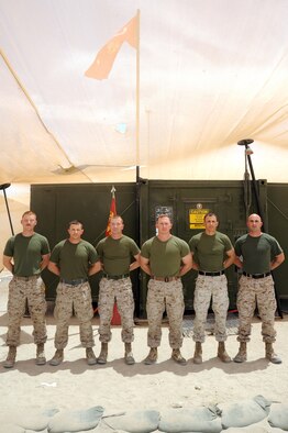 United States Marines Lance Cpl. Christopher Barrett, 1st Lt. Steve Nye, Staff Sgt. Justin Morgan, Gunnery Sgt. John Messer, Master Sgt. Jason Vann, and Warrant Officer Jeffery Lynch display their belt colors at the 386th Air Expeditionary Wing, Southwest Asia Apr 27, 2013. The Marines are deployed from Marine Air Control Squadron 1 Yuma, Ariz.