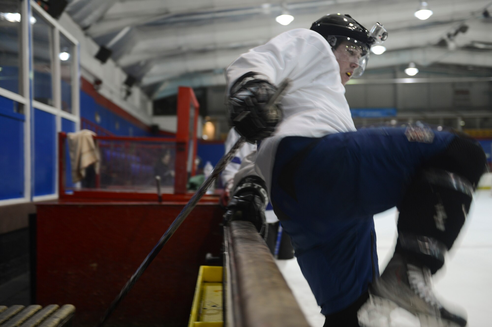 PETERBOROUGH, England -- Airman 1st Class Brendan McCormick, U.K. Warbirds player and member of the 48th Equipment Maintenance Squadron, hits the ice during a practice session March 29, 2013. The team is accepting new players and is open to all U.S. service members serving in the U.K. McCormick hails from White Lake, Mich. (U.S. Air Force photo by Staff Sgt. Stephen Linch)