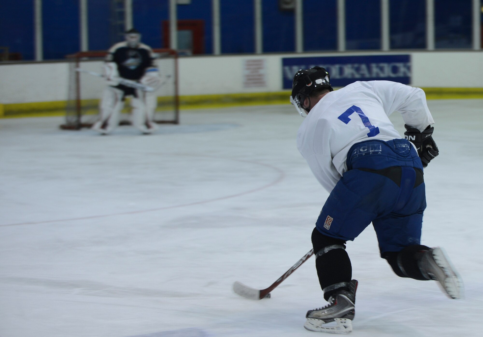 PETERBOROUGH, England - Airman 1st Class Brendan McCormick, U.K. Warbirds player and member of the 48th Equipment Maintenance Squadron, makes a fast break during a practice session March 29, 2013. The U.K. Warbirds is the U.S. Air Force hockey team in the U.K. McCormick hails from White Lake, Mich. (U.S. Air Force photo by Staff Sgt. Stephen Linch)