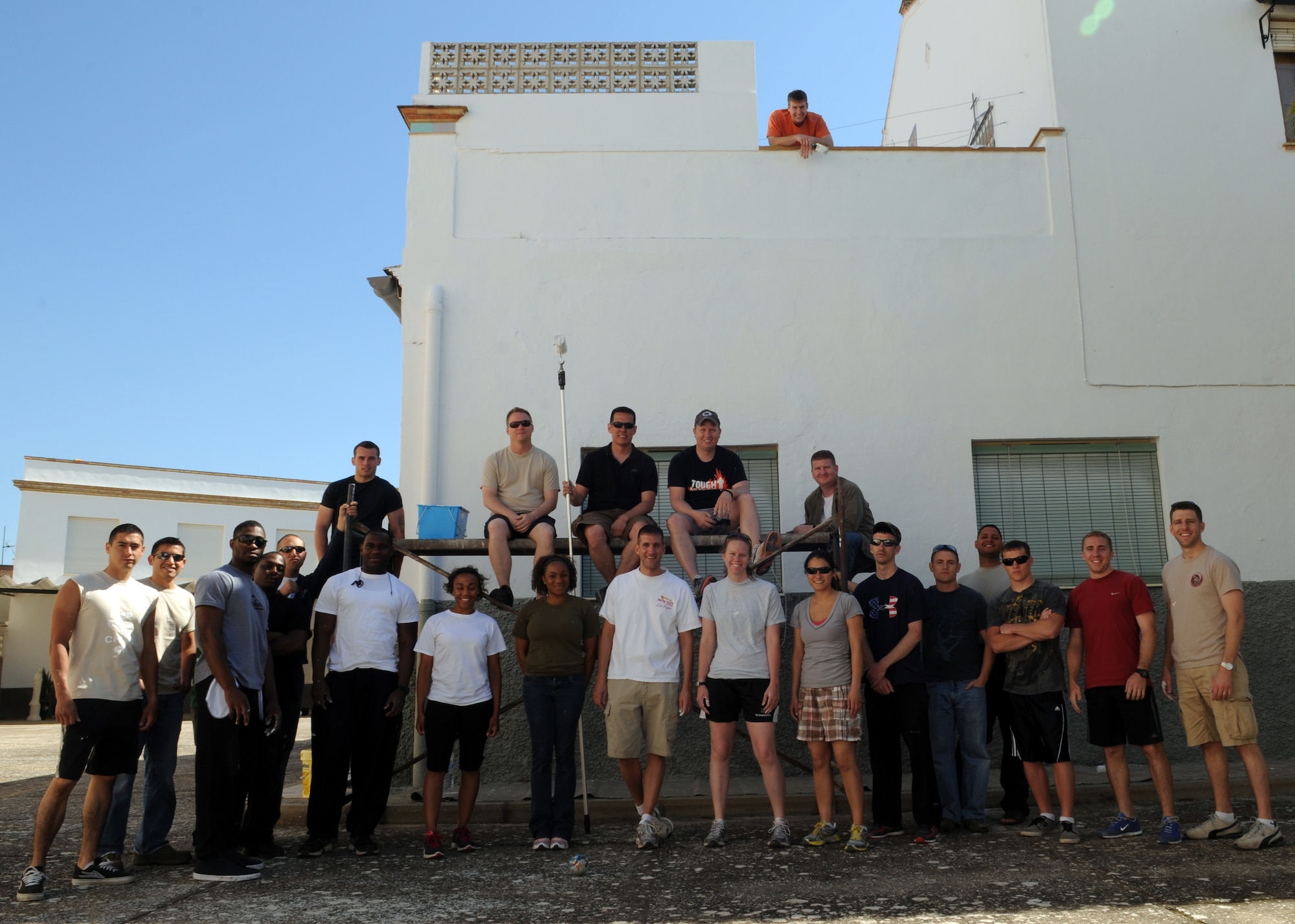 Airmen from the 100th Air Refueling Wing volunteer their time to paint a convent for local children April 25, 2013, in Southwest Europe. The Airmen took the opportunity to give their time to the local community and provide some necessary maintenance to the convent grounds. (U.S. Air Force photo by 1st Lt. Christopher Mesnard/Released) 