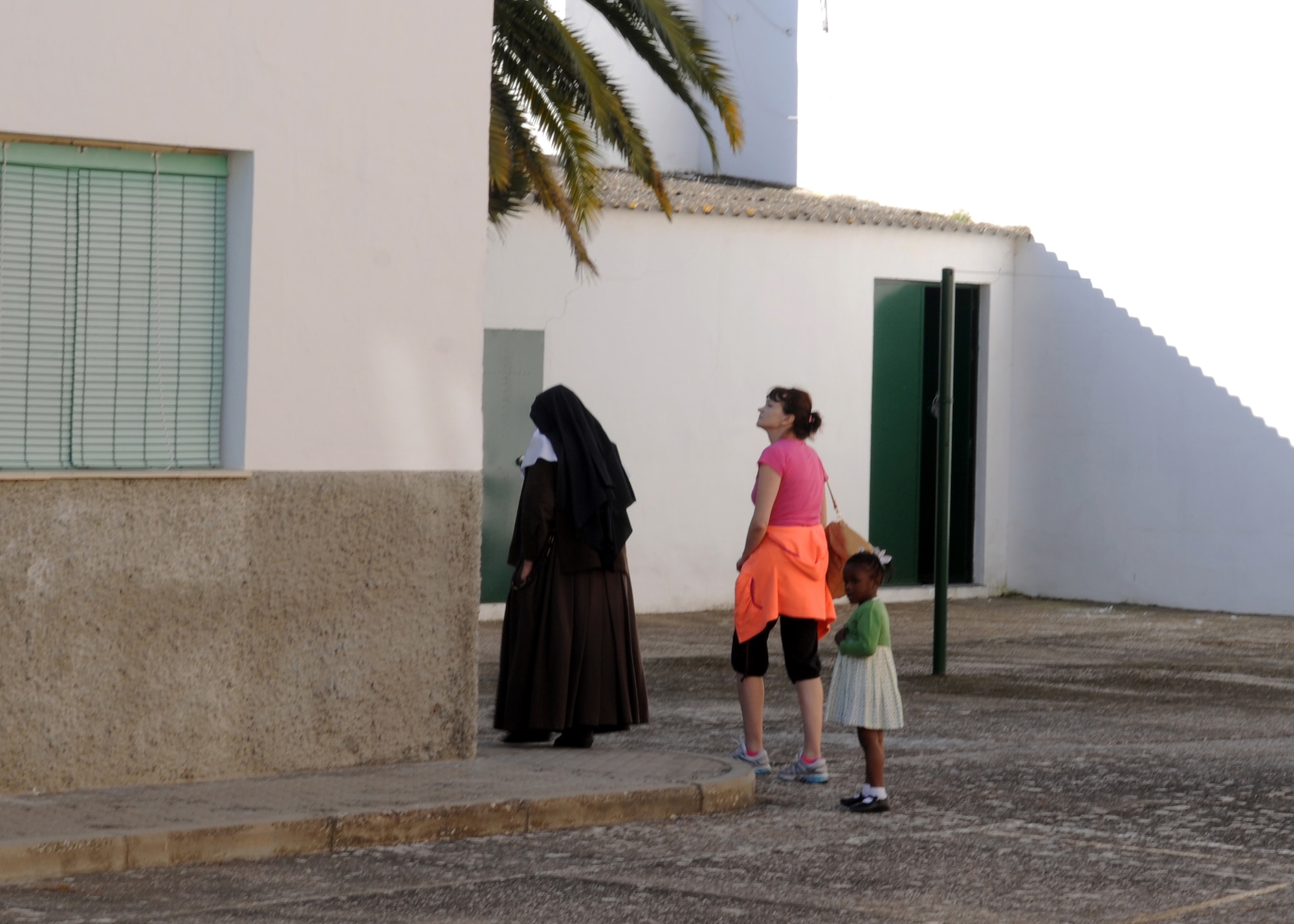 Airmen from the 100th Air Refueling Wing volunteered their time to paint a convent for children in the local community April 25, 2013, in Southwest Europe. The Airmen took the opportunity to give their time to the local community and provide some necessary maintenance to the convent grounds. (U.S. Air Force photo by 1st Lt. Christopher Mesnard/Released)