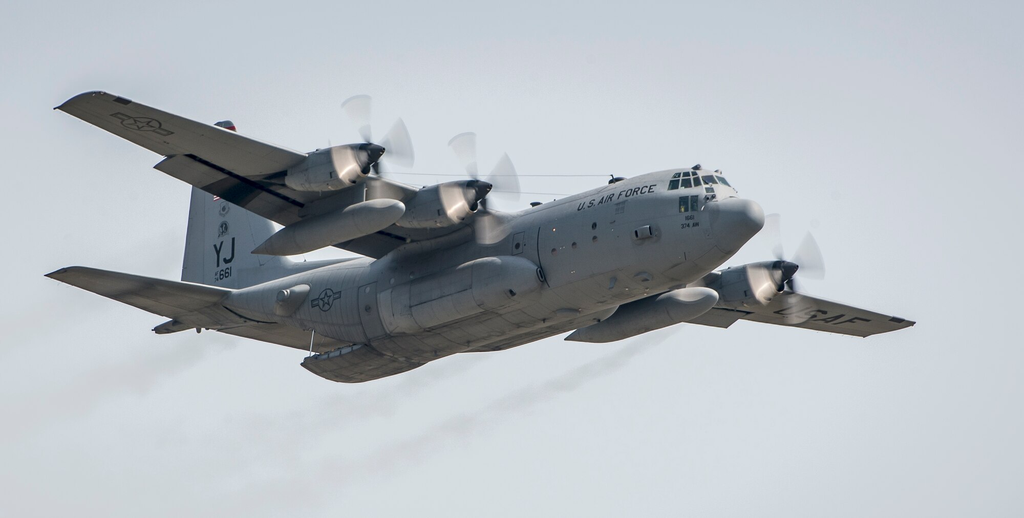 A U.S. Air Force C-130 Hercules flies over the airfield after a successful practice airdrop at Yokota Air Base, Japan, April 18, 2013. The “Herc” serves as the Air Force’s tactical airlift workhorse; its versatility makes it an ideal aircraft to rapidly transport troops and cargo in support of U.S. Pacific Command operations. (U.S. Air Force photo by Captain Raymond Geoffroy)