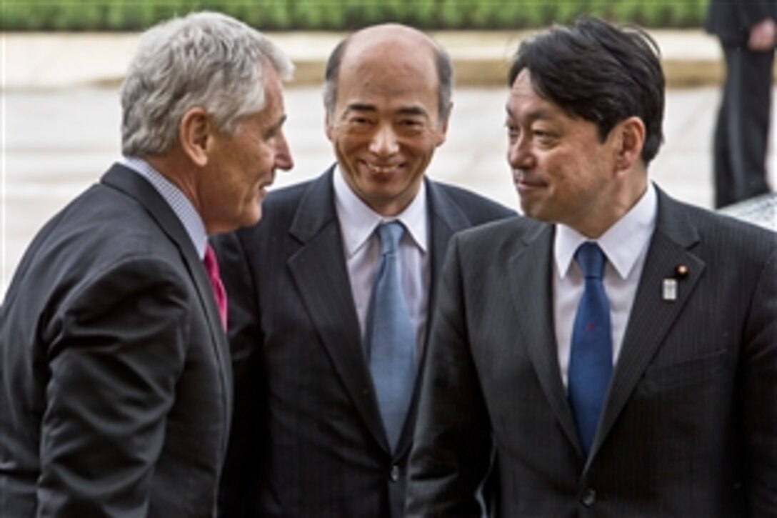 U.S. Defense Secretary Chuck Hagel, left, welcomes Japanese Defense Minister Itsunori Onodera, right, to the Pentagon, April 29, 2013. The two defense leaders met to discuss issues of mutual concern.