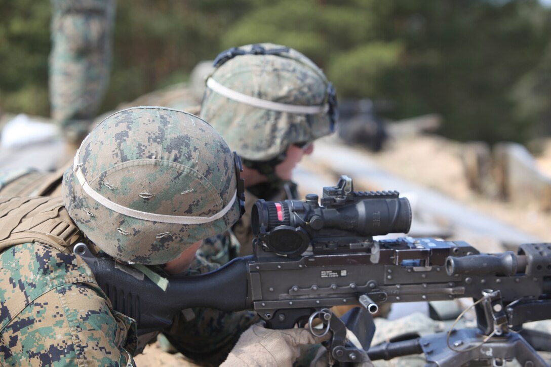 U.S. Marines and sailors with Black Sea Rotational Force 13 conduct live fire during exercie Summer Shield 10 aboard Camp Adazi, Latvia, April 24, 2013.  Exercise Summer Shield 10 focuses on integration of fires and maneuver in a joint environment to build partner nation capacity while enhancing our interoperability between the United States, Lithuania, Estonia, and Latvia. (U.S. Marine Corps photo by SSgt David Rakes, Sr./released)