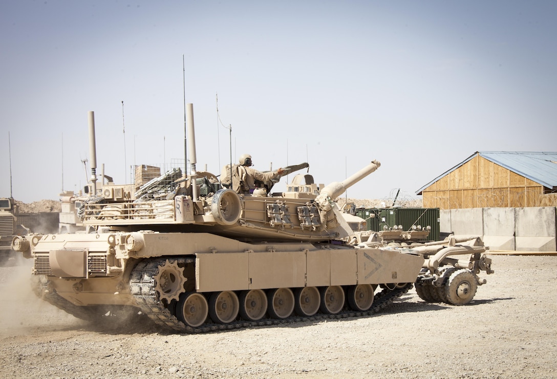U.S. Marine Corps Lance Cpl. Bryan Raspberry, a loader from Pantiac, Mich., assigned to Delta Company, 1st Tank Battalion, Regimental Combat Team 7, (RCT) 7, conducts function checks on an M1A1 Abrams tank on Camp Shir Ghazay, Helmand province, Afghanistan, April 27, 2013. Raspberry alongside the Marines and Sailors of Delta Company deployed to Afghanistan in support of Operation Enduring Freedom. (U.S. Marine Corps photo by Staff Sgt. Ezekiel R. Kitandwe/Released)
