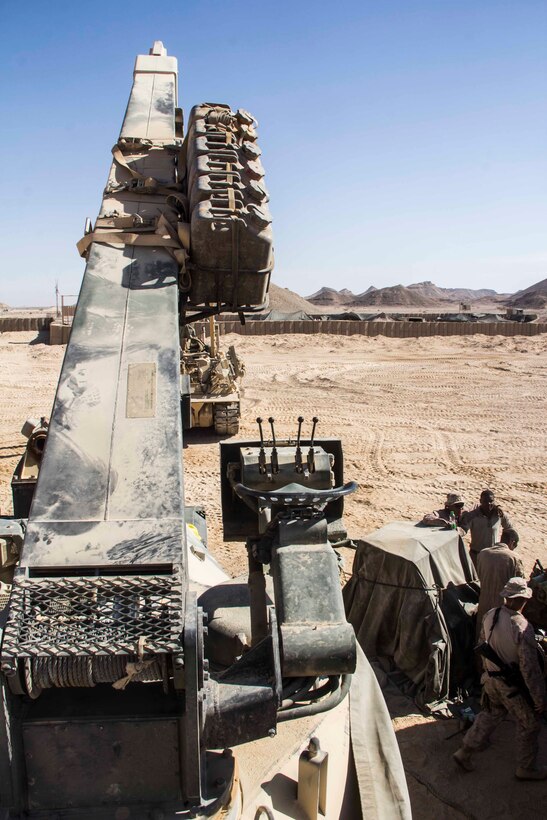 Marines assigned to Amphibious Assault Vehicle (AAV) Platoon, Battalion Landing Team 3/2, 26th Marine Expeditionary Unit (MEU) and Combat Logistics Battalion (CLB) 26, 26th MEU, work to replace an engine in one of the unit's AAVs during an exercise in the 5th Fleet area of responsibility April 28, 2013. The 26th MEU is currently deployed as part of the Kearsarge Amphibious Ready Group to the 5th Fleet area of responsibility. The 26th MEU operates continuously across the globe, providing the president and unified combatant commanders with a forward-deployed, sea-based quick reaction force. The MEU is a Marine Air-Ground Task Force capable of conducting amphibious operations, crisis response, and limited contingency operations.
(U.S. Marine Corps photo by Cpl. Michael S. Lockett/Released)
