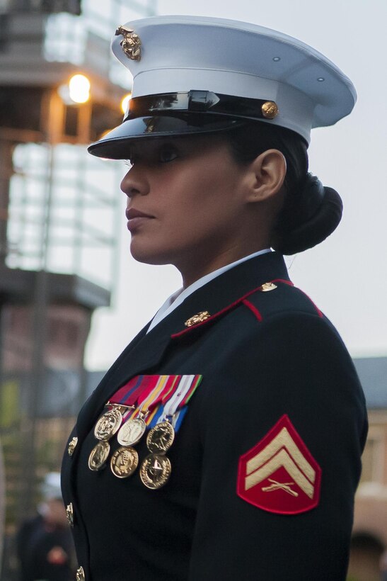 Cpl. Frances Durden, a ceremonial hoster with Marine Barracks Washington, D.C., stands her post at the main gate during a Friday Evening Parade at the Barracks April 26. 