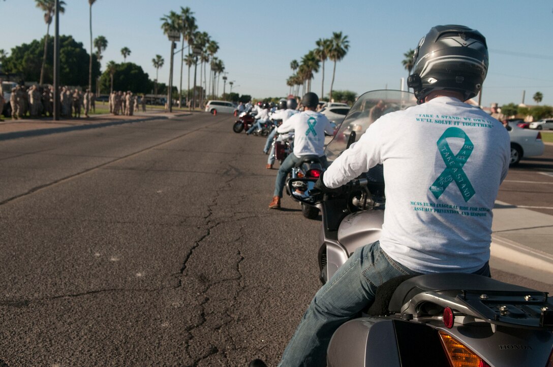 Active duty and retired Marines participated in the first annual "Take a Stand" bike ride at Marine Corps Air Station Yuma, Ariz., as a culminating event for Sexual Assault Awareness month, April 30. The event saw over 50 participants meet at the parade deck to kick off the morning activities which included morning colors, commander's guidance and a short dramatic skit.