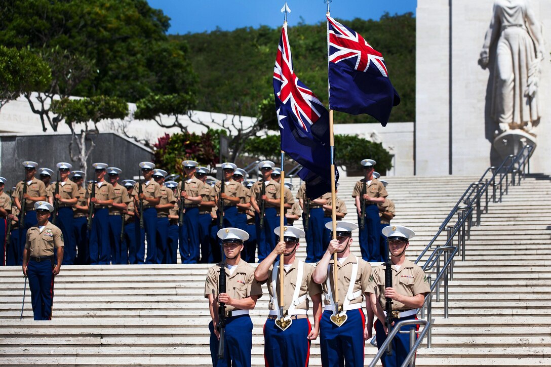 A Marine color guard from 3rd Marine Regiment carries the Australian and New Zealand Colors at the ANZAC Day ceremony here April 25. Every year, the Australian Consulate and New Zealand Embassy join with U.S. Marine Corps Forces, Pacific, to host a commemoration ceremony.