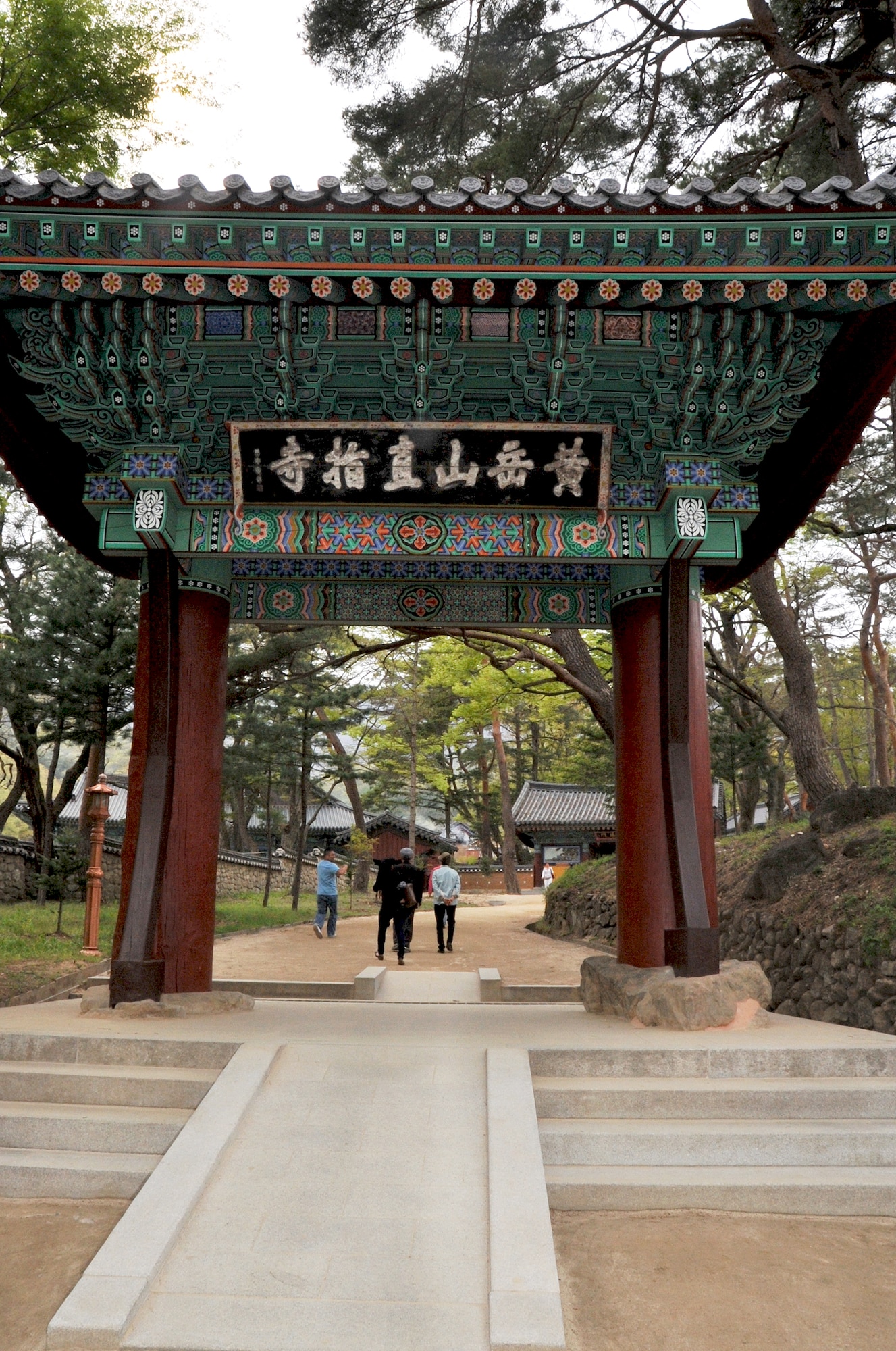 Iljumun is the first gate visitors walk through when entering the Hwangaksan Jikjisa Temple compound during an Information, Tickets and Travel trip April 27, 2013.  The gate symbolizes the beginning journey towards non-duality of mind. The Hwangaksan Jikjisa Temple was founded by monk Adohwasang in 418 of the Shilla Dynasty was built and located at the base of Mt. Hwangak. (U.S. Air Force photo/Senior Airman Kristina Overton) 