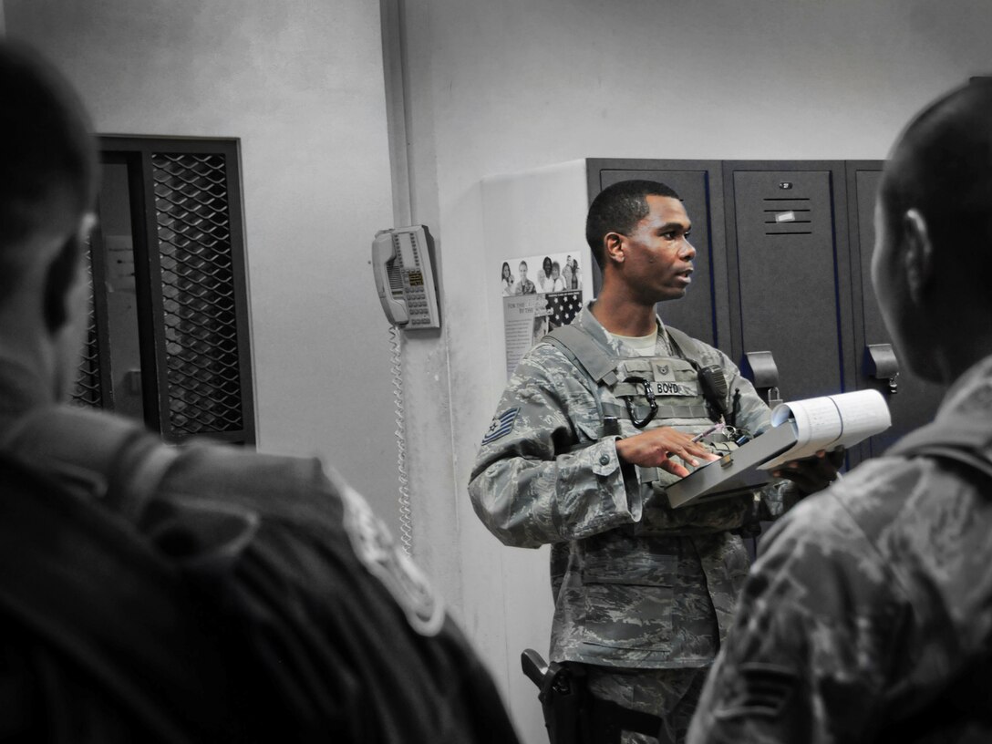 Tech. Sgt. Scottie Boyd, 36th Security Forces Squadron Law Enforcement and Security bravo flight sergeant, conducts a daily formation on Andersen Air Force Base, Guam, April 23, 2013. A flight sergeant’s administrative responsibilities include tracking enlisted performance reports, verifying flight members receive necessary training and providing documentation of training. (U.S. Air Force photo illustration by Airman 1st Class Marianique Santos/Released)