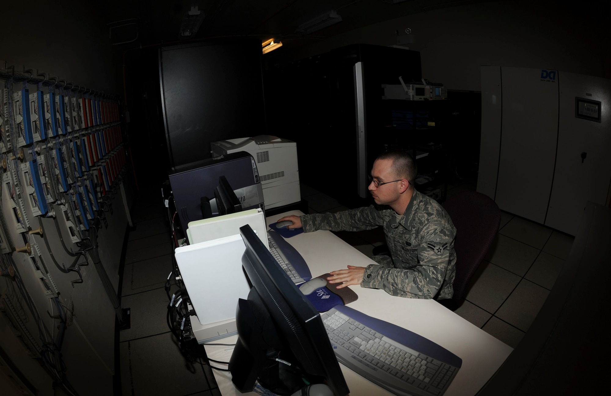 Airman 1st Class Nathaniel Greene, 28th Communications Squadron ground radar maintenance technician, monitors air traffic control, weather, ground aircraft control and warning radar systems at Ellsworth Air Force Base, S.D., April 16, 2013. The central control workstation ensures that proper readings, data collection and efficient communication systems are operating without any malfunctions. (U.S. Air Force photo by Airman 1st Class Anania Tekurio/Released) 