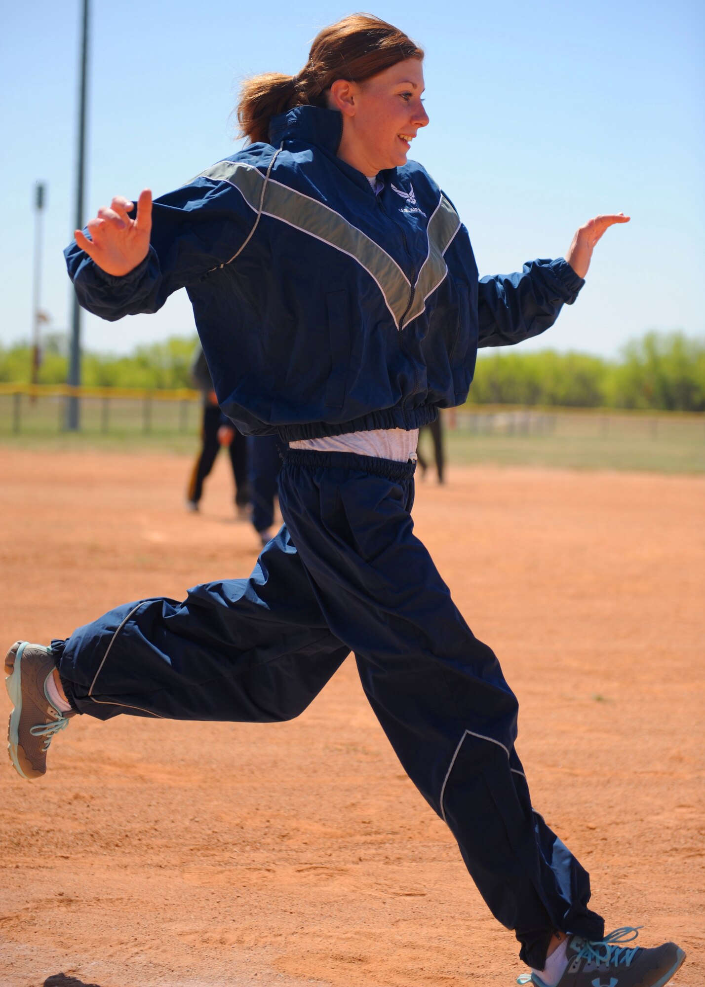 U.S. Air Force Airman 1st Class Molly Doherty, 7th Munitions Squadron, touches second base during a kickball tournament April 24, 2013, at Dyess AFB, Texas. The championship game was played between the 7th MUNS team and Marine Corps Reserves Detachment 1. (U.S. Air Force photo by Senior Airman Cierra Presentado/Released)