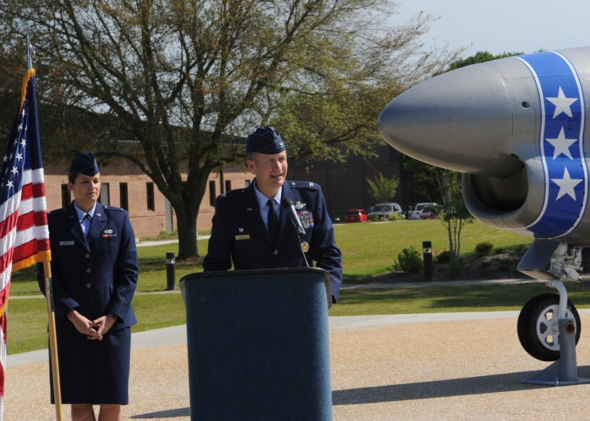 U.S. Air Force Col. Billy Thompson, 23d Wing commander, speaks during the F-86L Sabre dedication ceremony, while the master of ceremony, 2nd Lt. Martina Macon, 23d Logistics Readiness Squadron, stands aside at Moody Air Force Base, Ga., April 27, 2013. The F-86L Sabre stood as a memorial for Maj. Lyn McIntosh, a rescue pilot killed during Operation Eagle Claw , in Valdosta, Ga. It was relocated to the President George W. Bush Air Park at Moody Field and rededicated to McIntosh during the ceremony. (U.S. Air Force photo by Senior Airman Eileen Meier/Released)