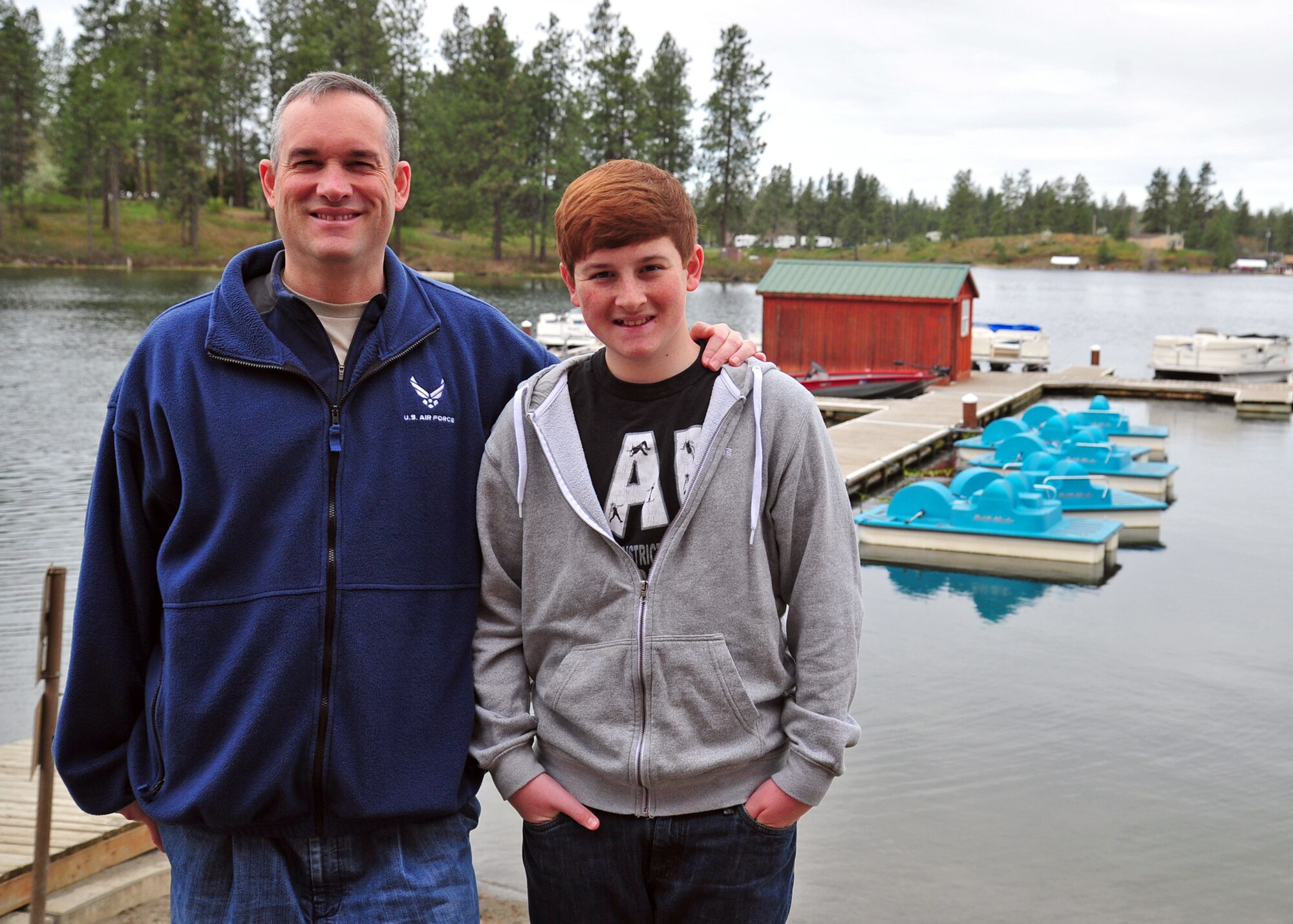Col. Brian Newberry, 92nd Air Refueling Wing commander, poses for a photo with his son, Matthew, during the opening day fishing derby at Clear Lake, Wash., April 27, 2013. “It is such a wonderful facility and recreation center open for our Airmen and their families,” said Newberry. (U.S. Air Force photo by Senior Airman Taylor Curry)
