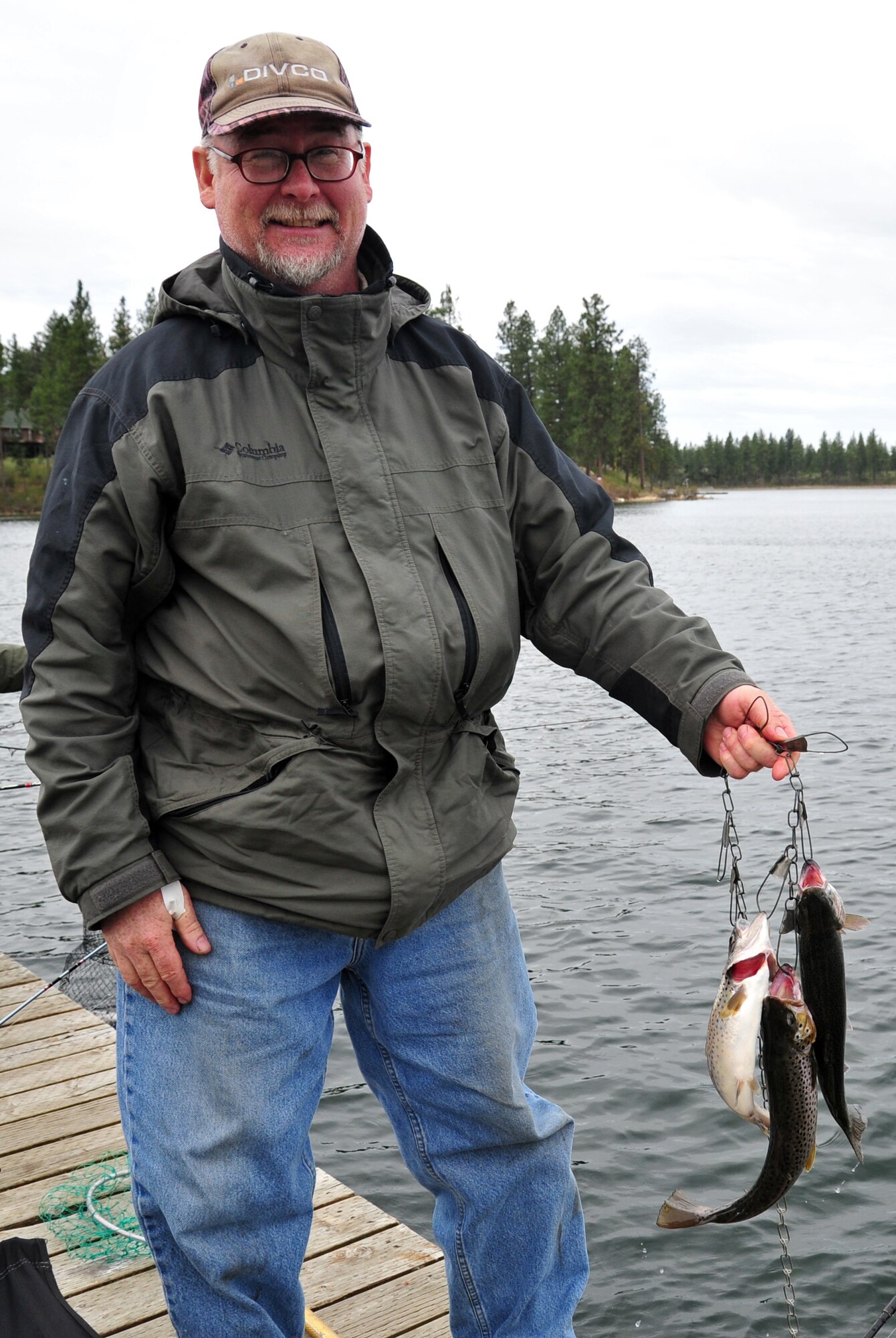 Mike Knapp displays a group of trout caught during the opening day fishing derby at Clear Lake, Wash., April 27, 2013. Knapp had been fishing at the lake from as early as 4 a.m. (U.S. Air Force photo by Senior Airman Taylor Curry)