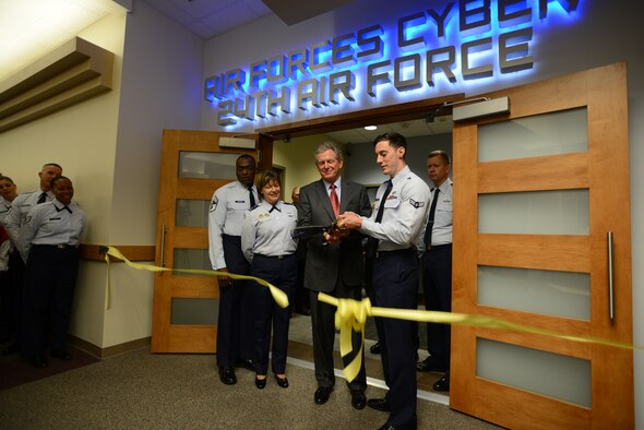 The 24th Air Force held a Ribbon-cutting ceremony followed by an Open House, April 30, marking the official opening of new facilities for Air Force cyber warriors, located on Port San Antonio.  Maj. Gen. Suzanne Vautrinot, 24th Air Force commander, presided over the event, welcoming visitors to tour the facility.  Approximately 500 guests, ranging from civic leaders to members' families, toured the high-tech facility, normally off-limits to both the public and most base personnel.  Eighteen spokespersons located throughout the facility informed visitors about the many facets of the Air Force cyber mission.
