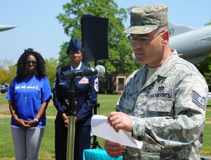 U.S. Air Force Tech. Sgt. Michael Shaw, 633rd Civil Engineer Squadron section planner, reads his poem entitled “Listen” during the Poetry Slam at Memorial Park, Langley Air Force Base, Va., April 26, 2013. Poems were written by members of the Langley community, including Chief Master Sgt. Trae R. King, 633rd Air Base Wing command chief [pictured in the photo], to build awareness about sexual assault. (U.S. Air Force photo by Airman 1st Class Victoria H. Taylor/Released)