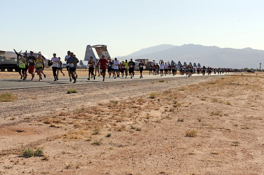 U.S. Active Duty Military and local Tucson residents enjoy the scenery of historic aircraft as they run the Desert Bonyard 5K Fun Run/Walk at the 309th Aerospace Maintenance and Regeneration Group at Davis-Monthan Air Force Base, Ariz., April 27, 2013. AMARG is a specialized facility within the Air Force Materiel Command structure. 309 AMARG provides critical aerospace maintenance and regeneration capabilities for Joint and Allied/Coalition warfighters in support of global operations and agile combat support for a wide range of military operations. (U.S. Air Force photo by Airman 1st Class Christine Griffiths/Released)